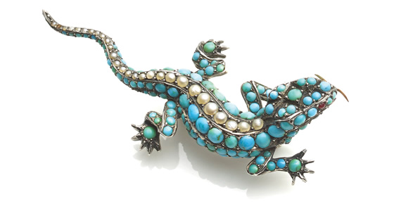 A Victorian silver mounted lizard set with cabochon turquoises and a single line of seed pearls, the eyes ruby set, 60 mm long, c1860, £1,500 from Richard Ogden Ltd